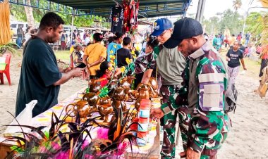 Satgas Pamtas Yonif 122/TS turut Mensukseskan kegiatan Festival Kelapa Ke-2 di Kampung Skouw Yambe Distrik Muaratami